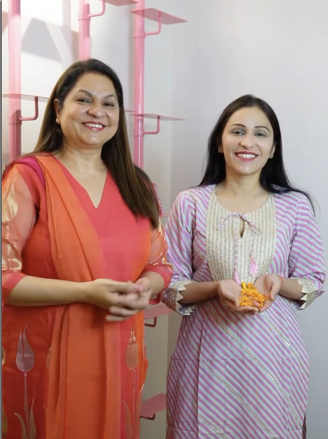 Mom and Nidhi with marigolds