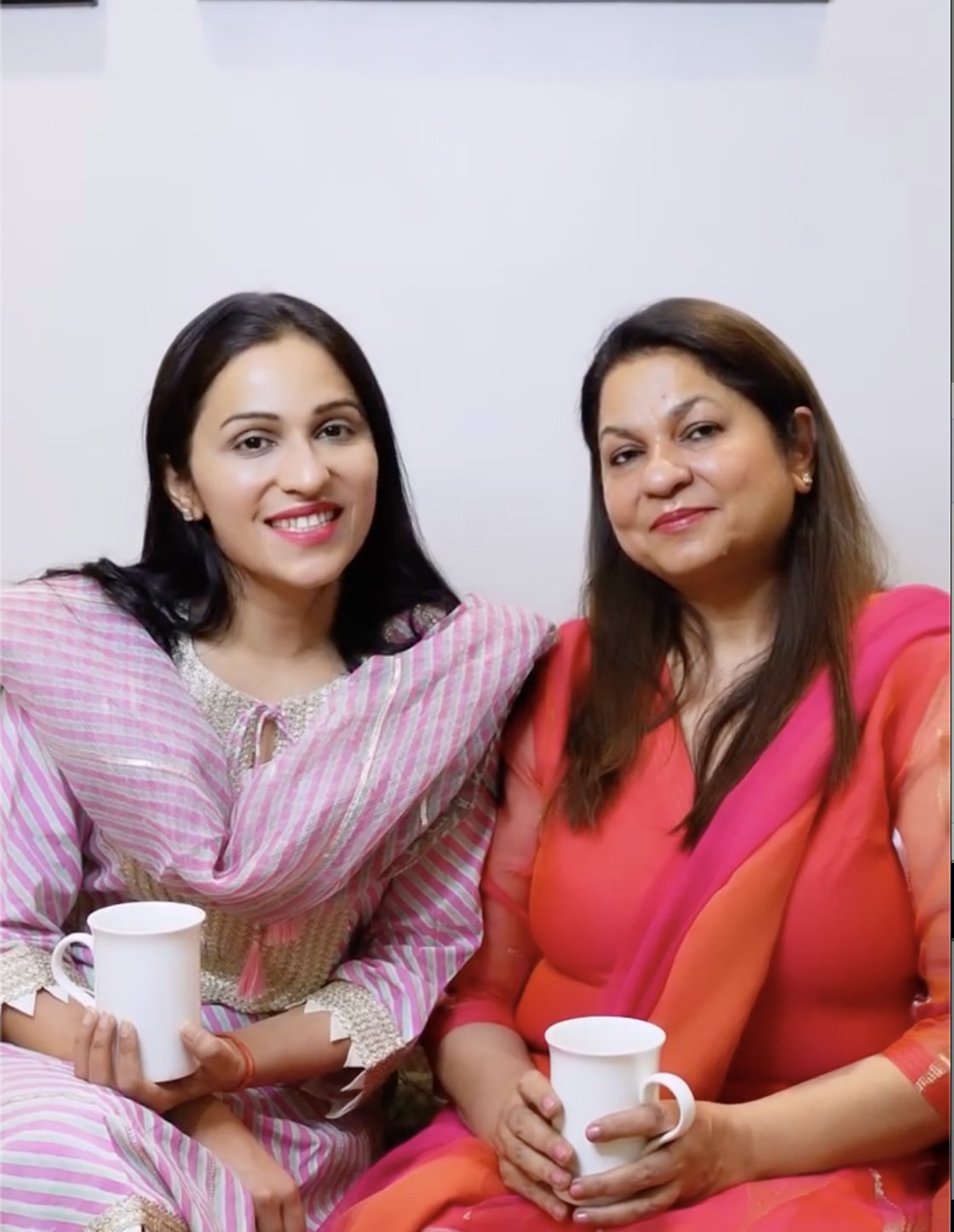Mom and Nidhi with cups of chai